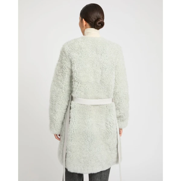 Woman wearing Yves Salomon shearling fur coat – luxury outerwear at Luxury Shoes 