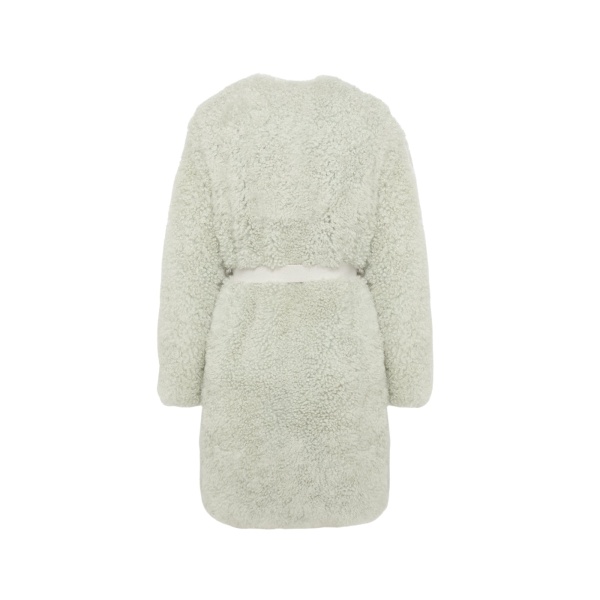 Woman wearing Yves Salomon shearling fur coat – luxury outerwear at Luxury Shoes 