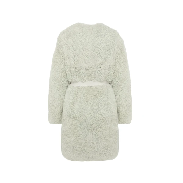 Woman wearing Yves Salomon shearling fur coat – luxury outerwear at Luxury Shoes 
