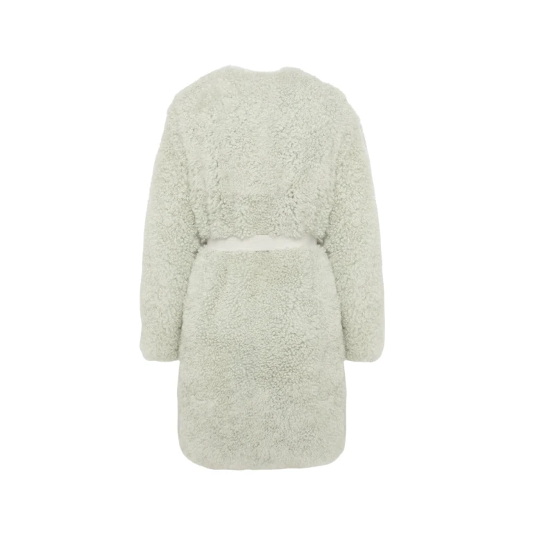 Woman wearing Yves Salomon shearling fur coat – luxury outerwear at Luxury Shoes 