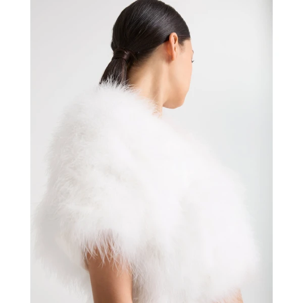 Woman wearing Yves Salomon shearling fur coat – luxury outerwear at Luxury Shoes 