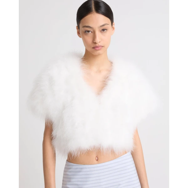 Woman wearing Yves Salomon shearling fur coat – luxury outerwear at Luxury Shoes 