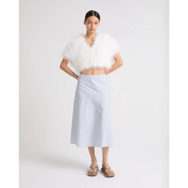 Woman wearing Yves Salomon shearling fur coat – luxury outerwear at Luxury Shoes 