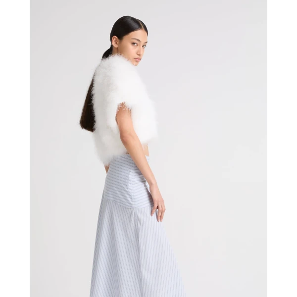 Woman wearing Yves Salomon shearling fur coat – luxury outerwear at Luxury Shoes 