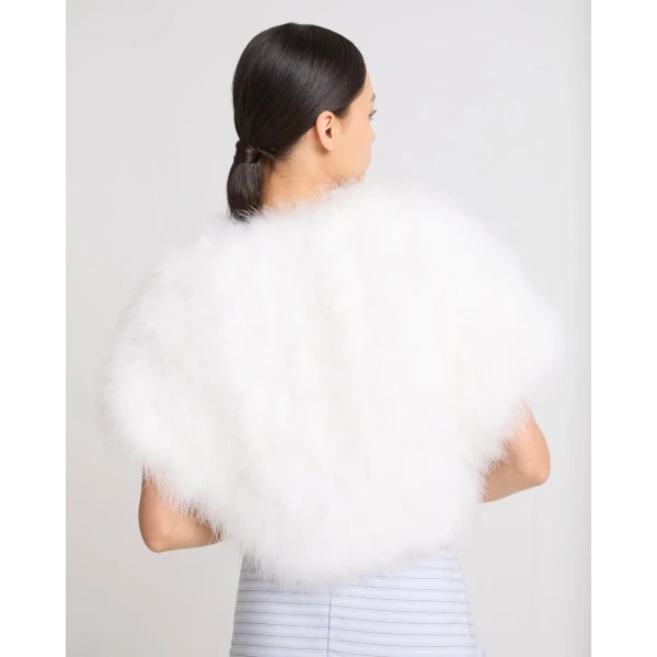Woman wearing Yves Salomon shearling fur coat – luxury outerwear at Luxury Shoes 