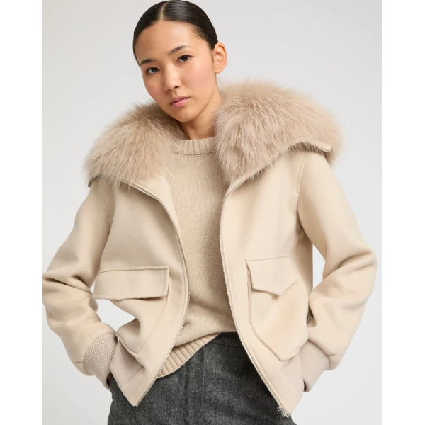 Woman wearing Yves Salomon shearling fur coat – luxury outerwear at Luxury Shoes 