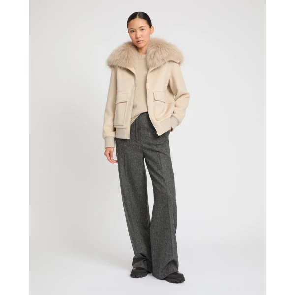 Woman wearing Yves Salomon shearling fur coat – luxury outerwear at Luxury Shoes 