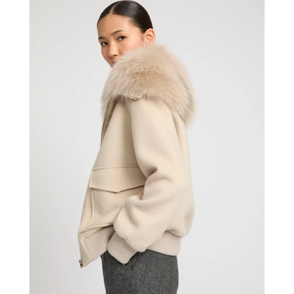 Woman wearing Yves Salomon shearling fur coat – luxury outerwear at Luxury Shoes 