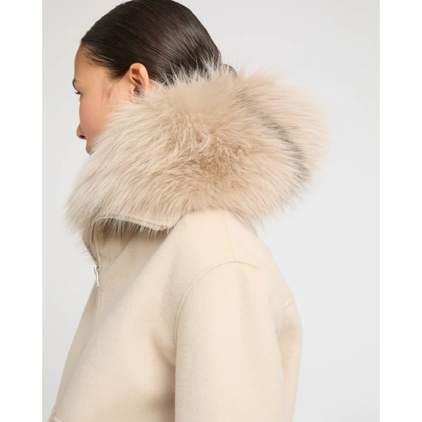 Woman wearing Yves Salomon shearling fur coat – luxury outerwear at Luxury Shoes 