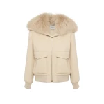 Woman wearing Yves Salomon shearling fur coat – luxury outerwear at Luxury Shoes 