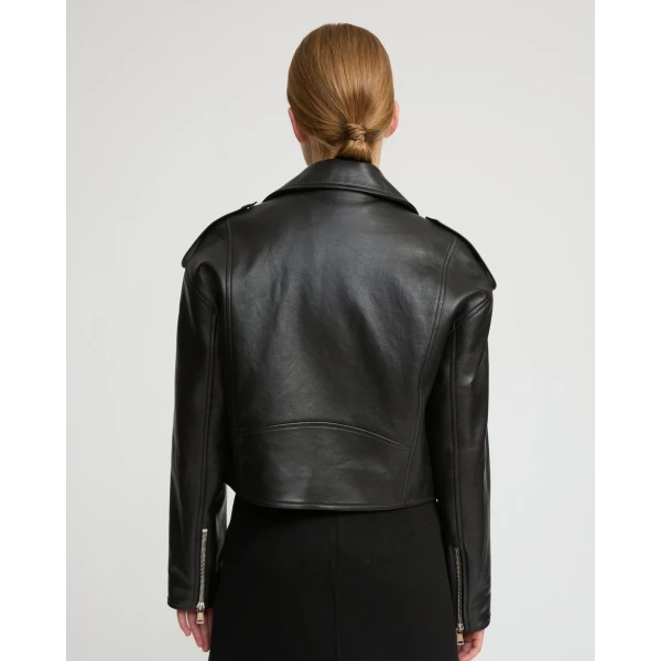 Woman wearing Yves Salomon shearling fur coat – luxury outerwear at Luxury Shoes 