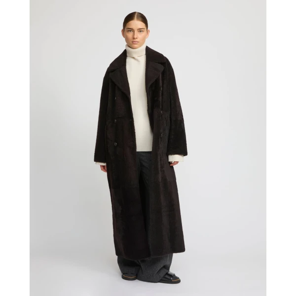Woman wearing Yves Salomon shearling fur coat – luxury outerwear at Luxury Shoes 