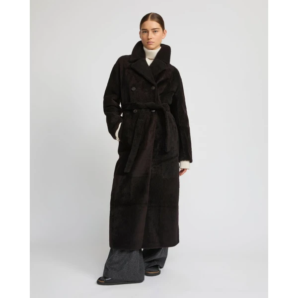 Woman wearing Yves Salomon shearling fur coat – luxury outerwear at Luxury Shoes 