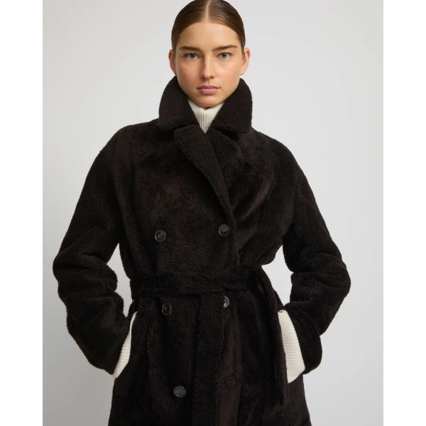 Woman wearing Yves Salomon shearling fur coat – luxury outerwear at Luxury Shoes 