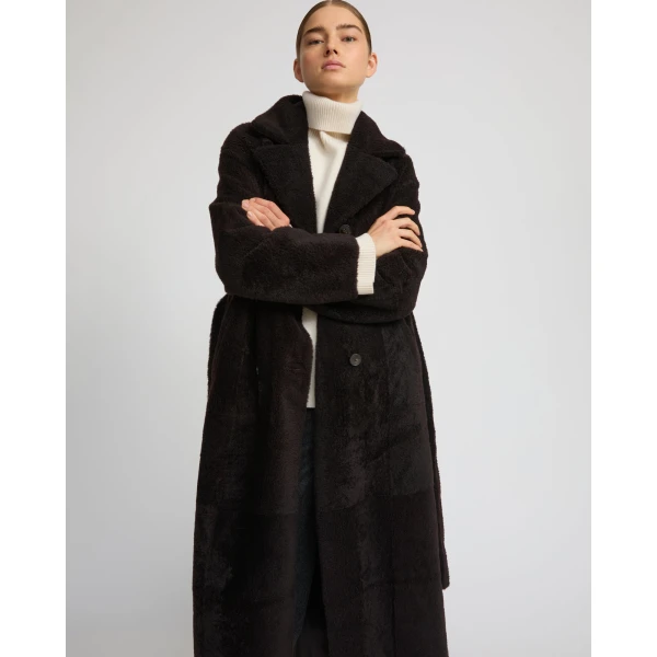 Woman wearing Yves Salomon shearling fur coat – luxury outerwear at Luxury Shoes 