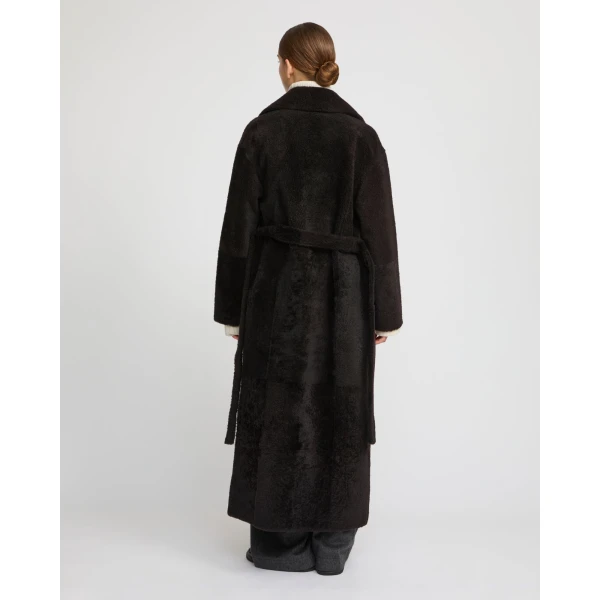 Woman wearing Yves Salomon shearling fur coat – luxury outerwear at Luxury Shoes 