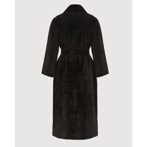 Woman wearing Yves Salomon shearling fur coat – luxury outerwear at Luxury Shoes 
