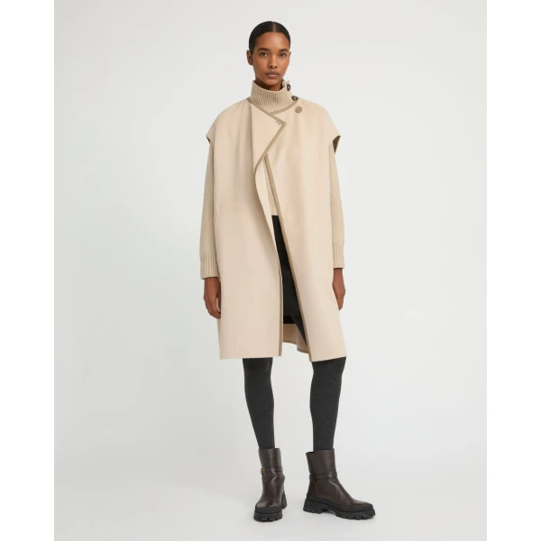 Woman wearing Yves Salomon shearling fur coat – luxury outerwear at Luxury Shoes 