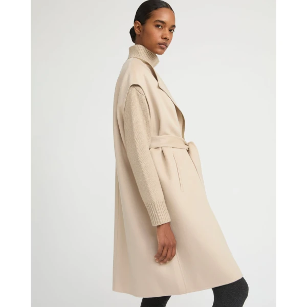 Woman wearing Yves Salomon shearling fur coat – luxury outerwear at Luxury Shoes 