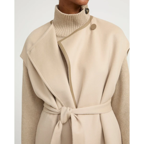 Woman wearing Yves Salomon shearling fur coat – luxury outerwear at Luxury Shoes 