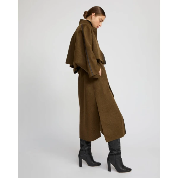 Woman wearing Yves Salomon shearling fur coat – luxury outerwear at Luxury Shoes 