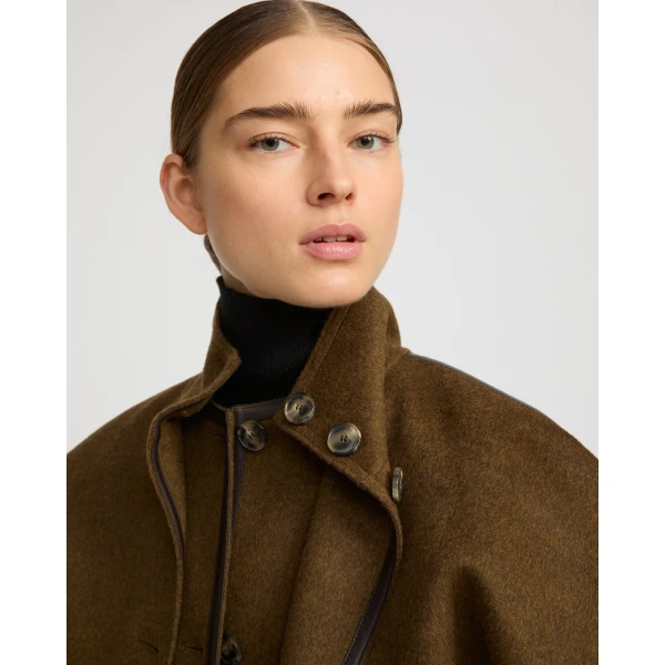 Woman wearing Yves Salomon shearling fur coat – luxury outerwear at Luxury Shoes 