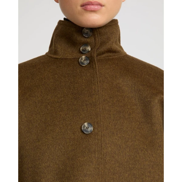 Woman wearing Yves Salomon shearling fur coat – luxury outerwear at Luxury Shoes 