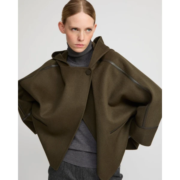 Woman wearing Yves Salomon shearling fur coat – luxury outerwear at Luxury Shoes 