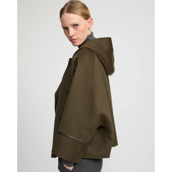 Woman wearing Yves Salomon shearling fur coat – luxury outerwear at Luxury Shoes 