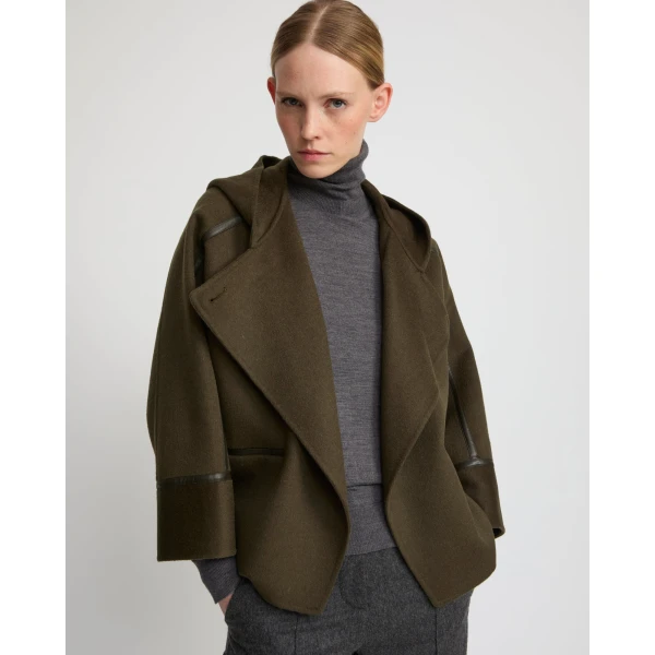 Woman wearing Yves Salomon shearling fur coat – luxury outerwear at Luxury Shoes 