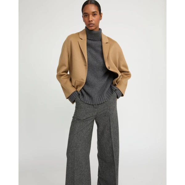 Woman wearing Yves Salomon shearling fur coat – luxury outerwear at Luxury Shoes 
