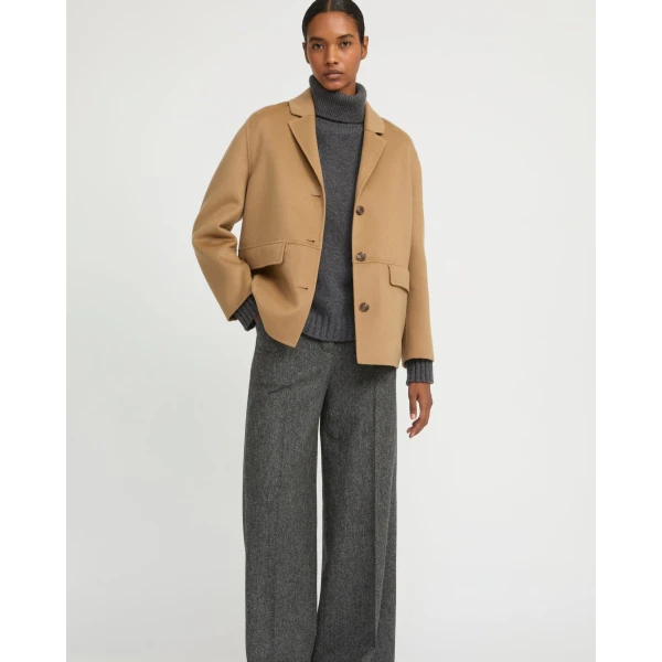 Woman wearing Yves Salomon shearling fur coat – luxury outerwear at Luxury Shoes 