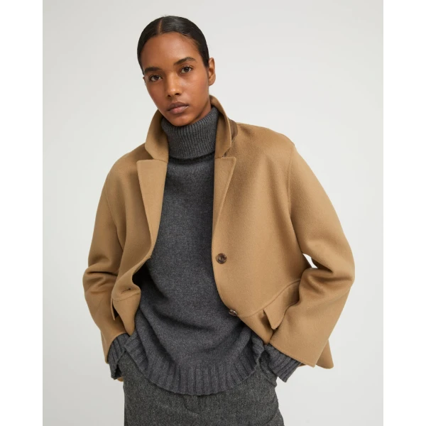 Woman wearing Yves Salomon shearling fur coat – luxury outerwear at Luxury Shoes 