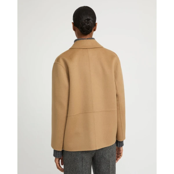 Woman wearing Yves Salomon shearling fur coat – luxury outerwear at Luxury Shoes 