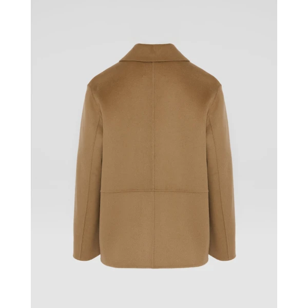 Woman wearing Yves Salomon shearling fur coat – luxury outerwear at Luxury Shoes 