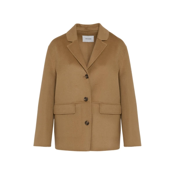 Woman wearing Yves Salomon shearling fur coat – luxury outerwear at Luxury Shoes 