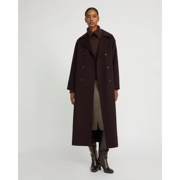 Woman wearing Yves Salomon shearling fur coat – luxury outerwear at Luxury Shoes 