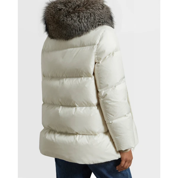 Woman wearing Yves Salomon shearling fur coat – luxury outerwear at Luxury Shoes 