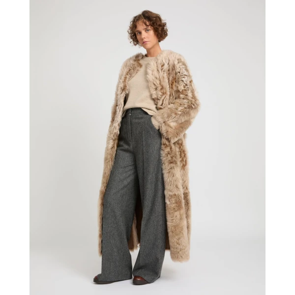 Woman wearing Yves Salomon shearling fur coat – luxury outerwear at Luxury Shoes 