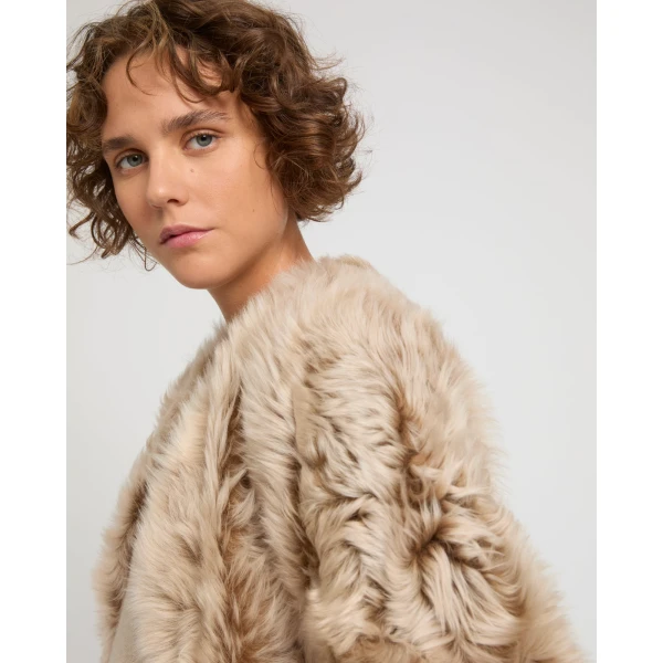 Woman wearing Yves Salomon shearling fur coat – luxury outerwear at Luxury Shoes 