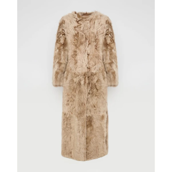 Woman wearing Yves Salomon shearling fur coat – luxury outerwear at Luxury Shoes 