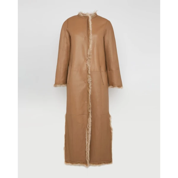 Woman wearing Yves Salomon shearling fur coat – luxury outerwear at Luxury Shoes 