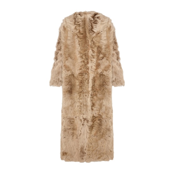 Woman wearing Yves Salomon shearling fur coat – luxury outerwear at Luxury Shoes 