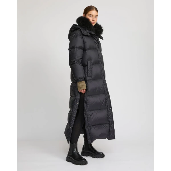 Woman wearing Yves Salomon shearling fur coat – luxury outerwear at Luxury Shoes 