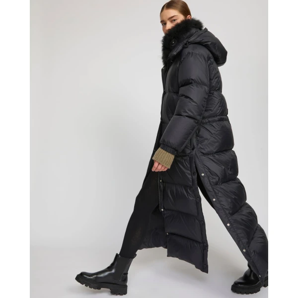 Woman wearing Yves Salomon shearling fur coat – luxury outerwear at Luxury Shoes 