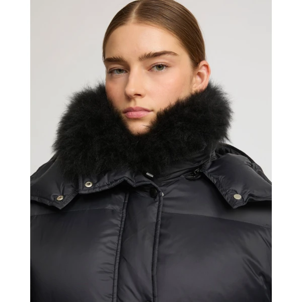 Woman wearing Yves Salomon shearling fur coat – luxury outerwear at Luxury Shoes 