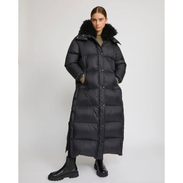 Woman wearing Yves Salomon shearling fur coat – luxury outerwear at Luxury Shoes 