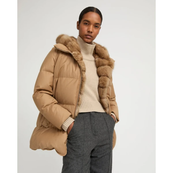 Woman wearing Yves Salomon shearling fur coat – luxury outerwear at Luxury Shoes 
