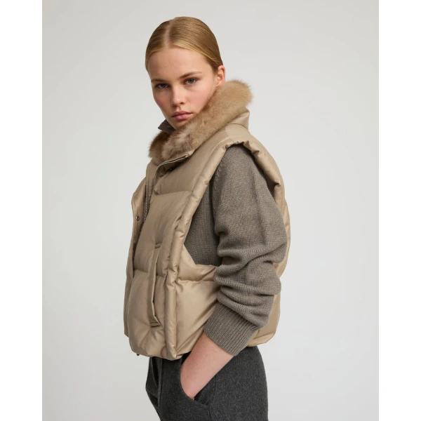 Woman wearing Yves Salomon shearling fur coat – luxury outerwear at Luxury Shoes 