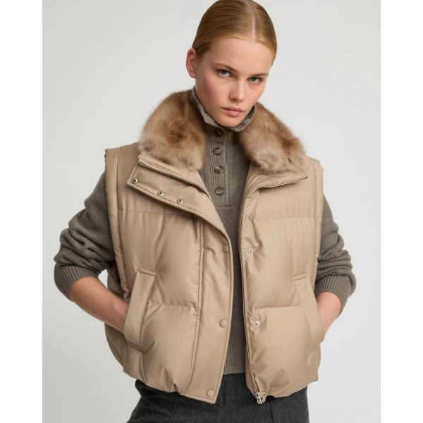 Woman wearing Yves Salomon shearling fur coat – luxury outerwear at Luxury Shoes 